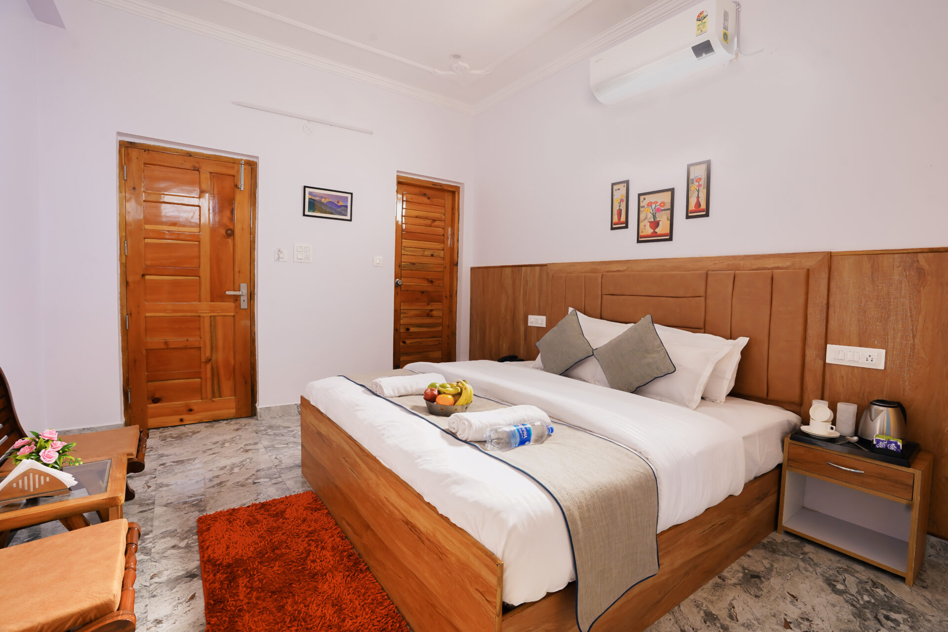 Deluxe Room at Hotel Sparrow Dharamshala — double bed, city-facing balcony, work desk and smart TV
